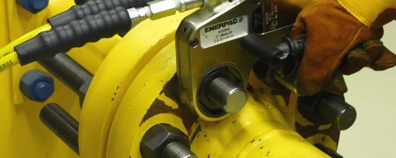 Enerpac torque wrench being used on a flanged pipe joint