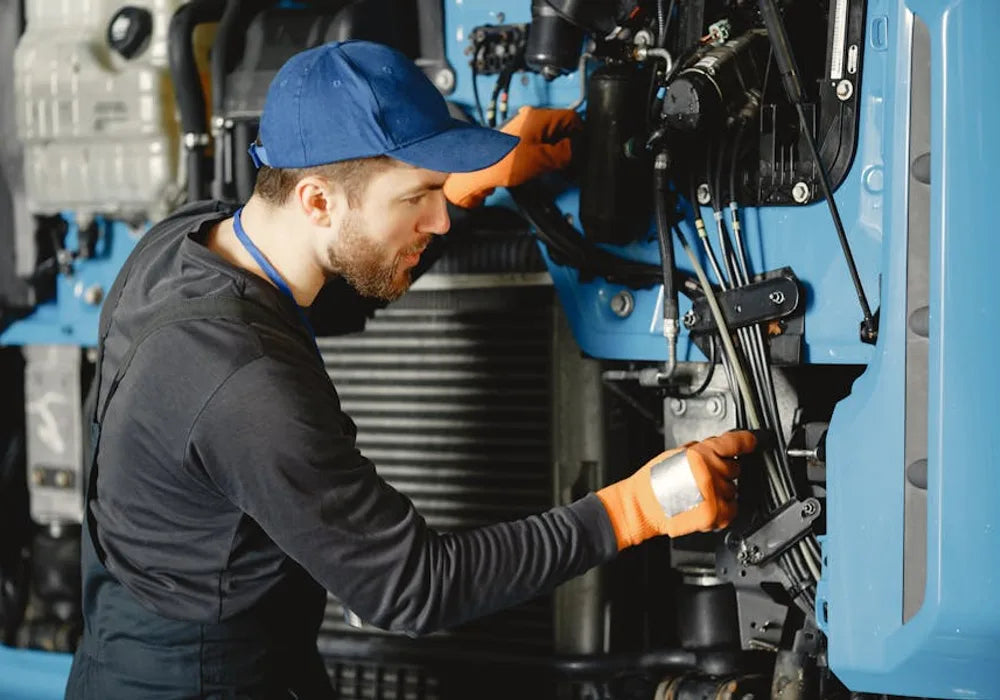 AD Automation technician working on industrial hydraulic equipment