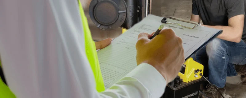AD Automation specialist providing on-site technical support with Enerpac hydraulic equipment